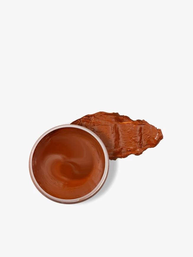 Leuchtend orange Schuhcreme