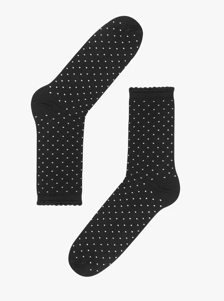 Schwarze Socken mit beigen Tupfen und Rüschenbesatz