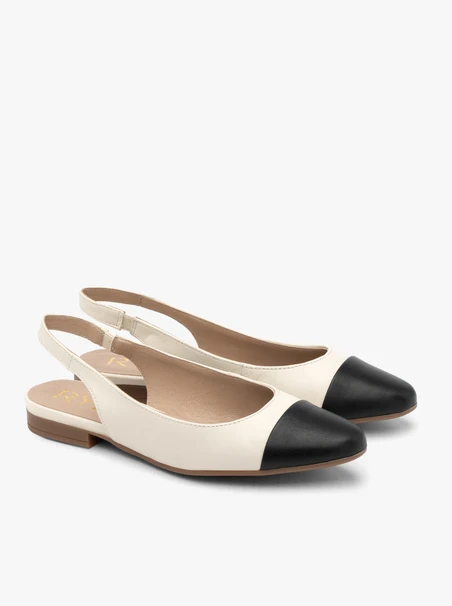 Cremefarbene und schwarze Slingback-Ballerinas