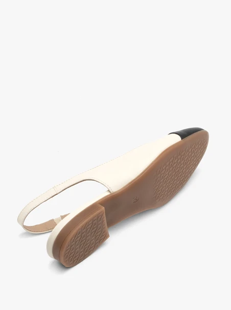 Cremefarbene und schwarze Slingback-Ballerinas
