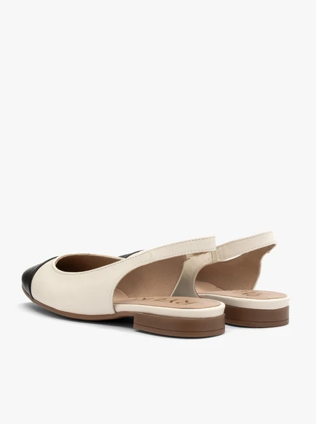 Cremefarbene und schwarze Slingback-Ballerinas