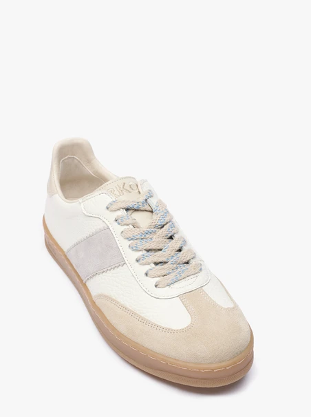 Cremefarbene Turnschuhe mit grauem Riemen