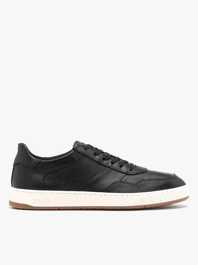Schwarze halbe Sportschuhe mit weißem und beigem Untergrund