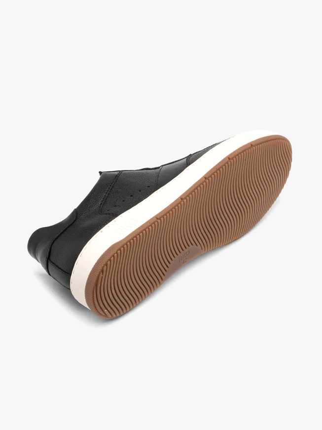 Schwarze halbe Sportschuhe mit weißem und beigem Untergrund