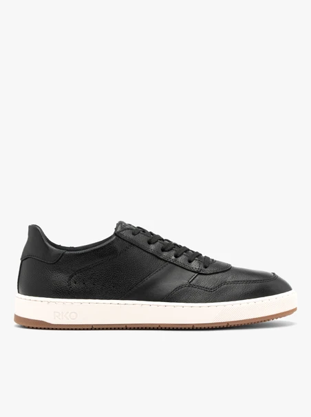 Schwarze halbe Sportschuhe mit weißem und beigem Untergrund