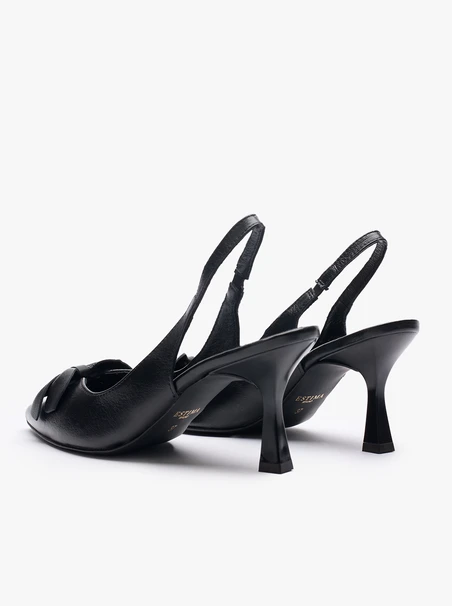 Schwarze absatzlose Slingback-Pumps mit Blumenverzierung